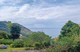 Haystacks with sea and mountain views