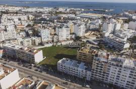 Urban land with 6430 m2 and approved PIP located next to Rotunda do Cubo in Olhão.