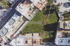 Urban land with 6430 m2 and approved PIP located next to Rotunda do Cubo in Olhão.