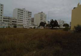 Urban land with 6430 m2 and approved PIP located next to Rotunda do Cubo in Olhão.