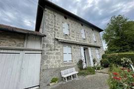 Stone house with outbuildings in the town of Saint-Denis-des-Murs