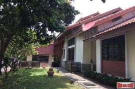 A private compound with a pool villa, a second house and more in Nakhon Pathom.