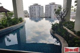 Sky Walk Condo - City Views from this One Bedroom + Study Room in Phra Khanong