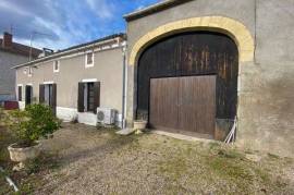 A stone built riverside property with an attached barn ripe for renovation!