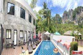 7-room small resort with a pool surrounded by mountain views for sale in Ao Nang, Krabi.