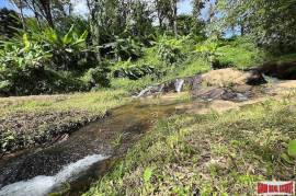 Peaceful 2 Rai, 3 Nga Land Plot with Small Waterfall for Sale in Thalang