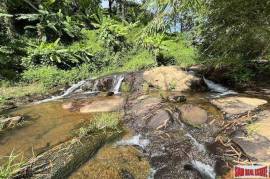 Peaceful 2 Rai, 3 Nga Land Plot with Small Waterfall for Sale in Thalang