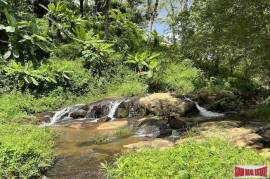 Peaceful 2 Rai, 3 Nga Land Plot with Small Waterfall for Sale in Thalang