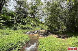 Peaceful 2 Rai, 3 Nga Land Plot with Small Waterfall for Sale in Thalang