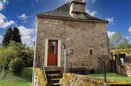 CORREZE. MARCILLAC LA CROISILLE. Stone house with 2 bedrooms, sous-sol, well, bread oven and garden of 1190m2.