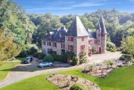 CORREZE Near UZERCHE. Wonderful 13th century stone castle with 3 gites, lake and land of 12 hectares.