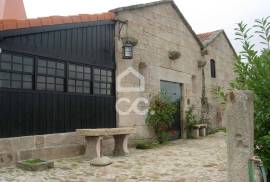 Typical Restaurant, in stone, with surrounding vineyard plantation in a village near Chaves