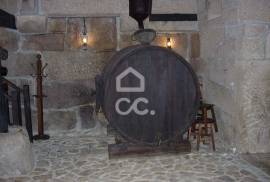 Typical Restaurant, in stone, with surrounding vineyard plantation in a village near Chaves