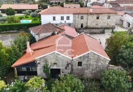 Typical Restaurant, in stone, with surrounding vineyard plantation in a village near Chaves