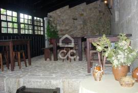 Typical Restaurant, in stone, with surrounding vineyard plantation in a village near Chaves