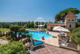 Nestling in 5 hectares of glorious land with beautiful gardens, pool and outbuildings, is this exceptional 6 bedroom French Chateau enjoying panoramic views from its peaceful location near all ameniti...