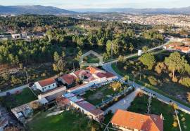 Building land with annexes on the outskirts of the city